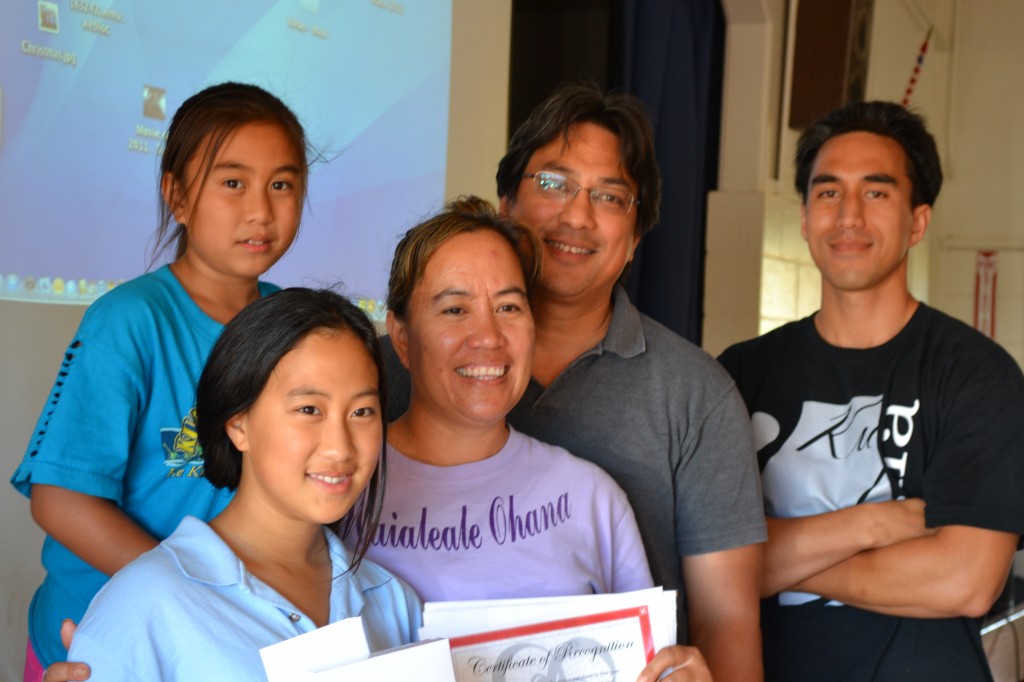 Sixth grader Maile Sasada won first place at the Kualapu`u School Tech Show. She is pictured here with her family. Photo by Catherine Aki