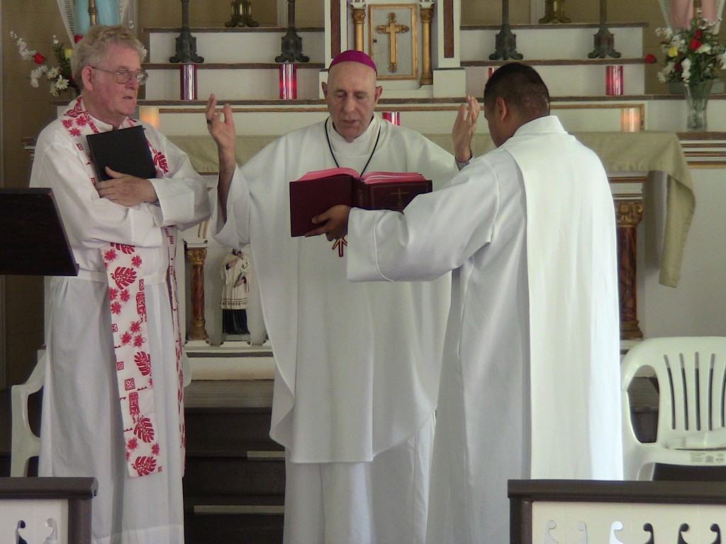 Father Patrick Killilea (left) was installed on July 11 as the new pastor of Kalaupapa’s St. Francis Church by Honolulu Bishop Larry Silva (center). Photo by Mark Miller.