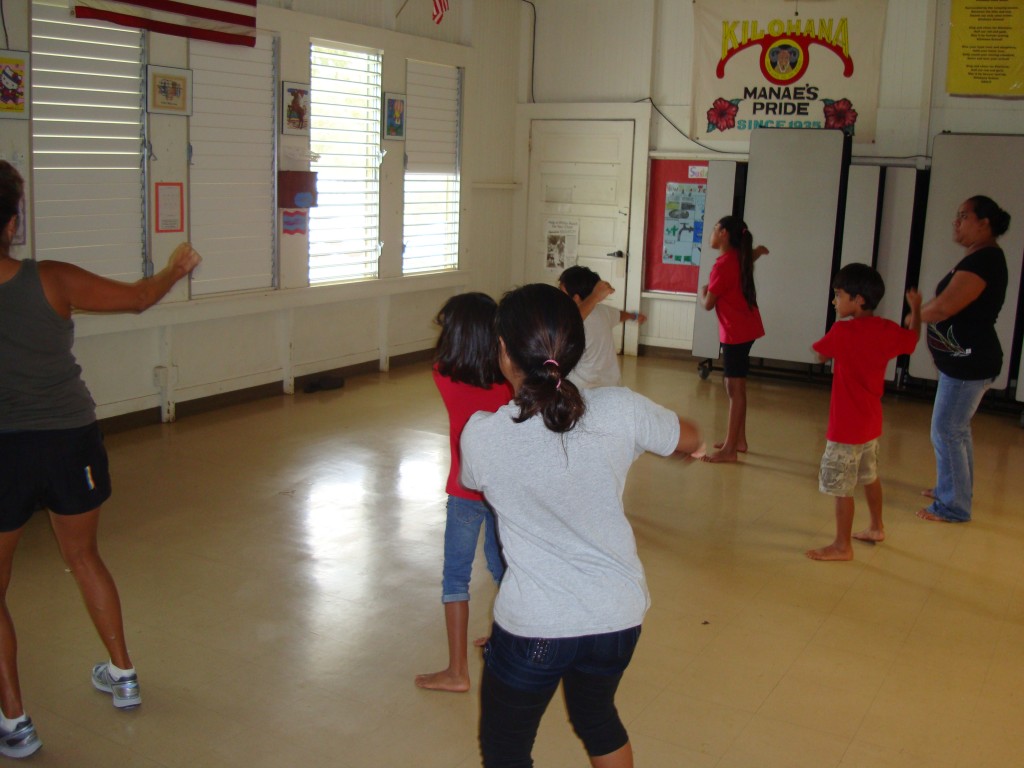 The Kilohana Dancercise class follows along as their instructor Lani Sawyer (on left) gets them moving to the beat.