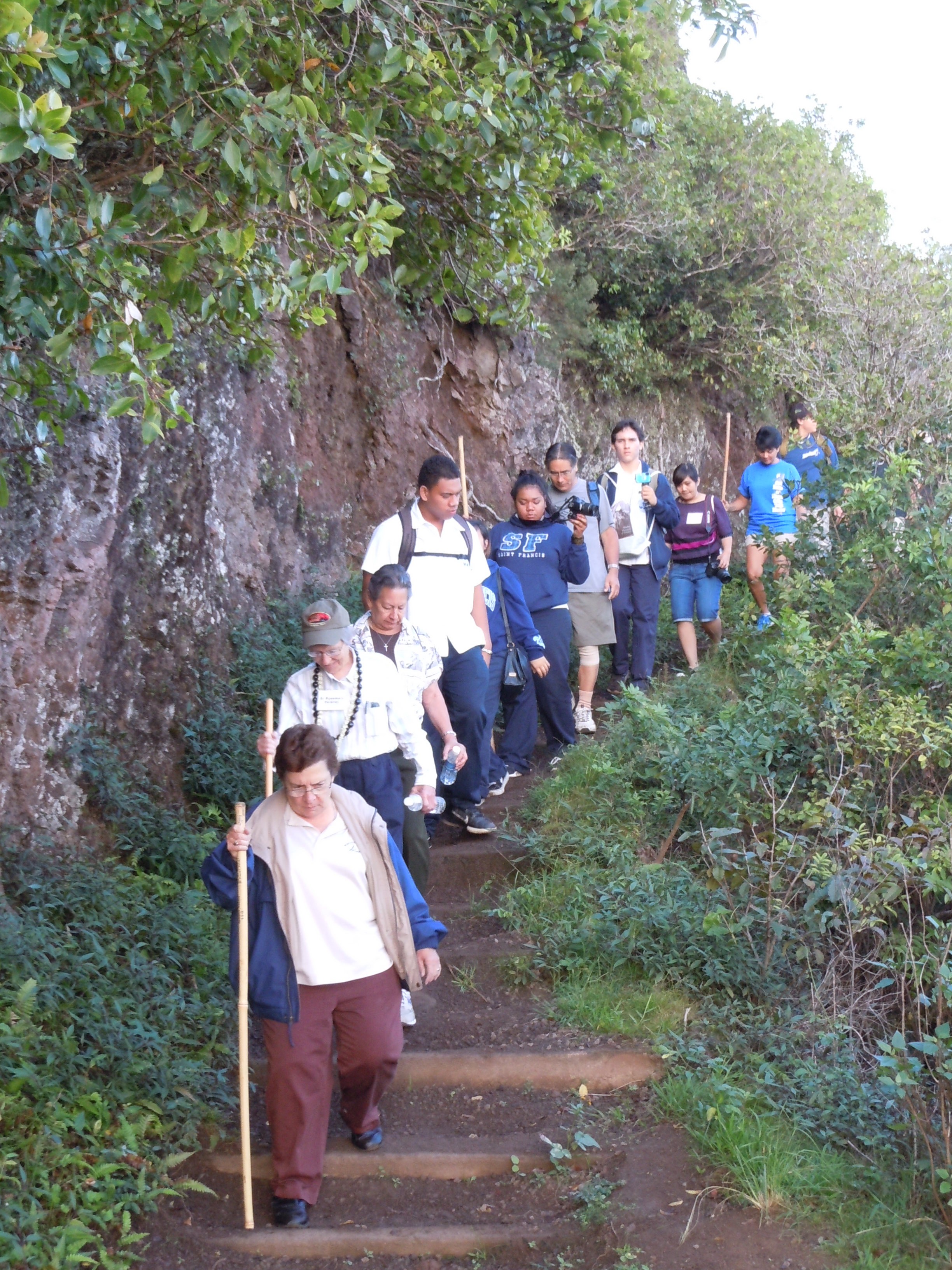 A group of Franciscan sisters, students from St. Francis High School on Oahu, and a few Molokai residents hiked with the relic down to Kalaupapa. Photo by Catherine Cluett