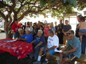 Community members, American Safari Cruises staff, state officials and protesters gathered last Wednesday in a spirit of understanding to sign an agreement that concludes more than a year of conflicts. Photo by Catherine Cluett